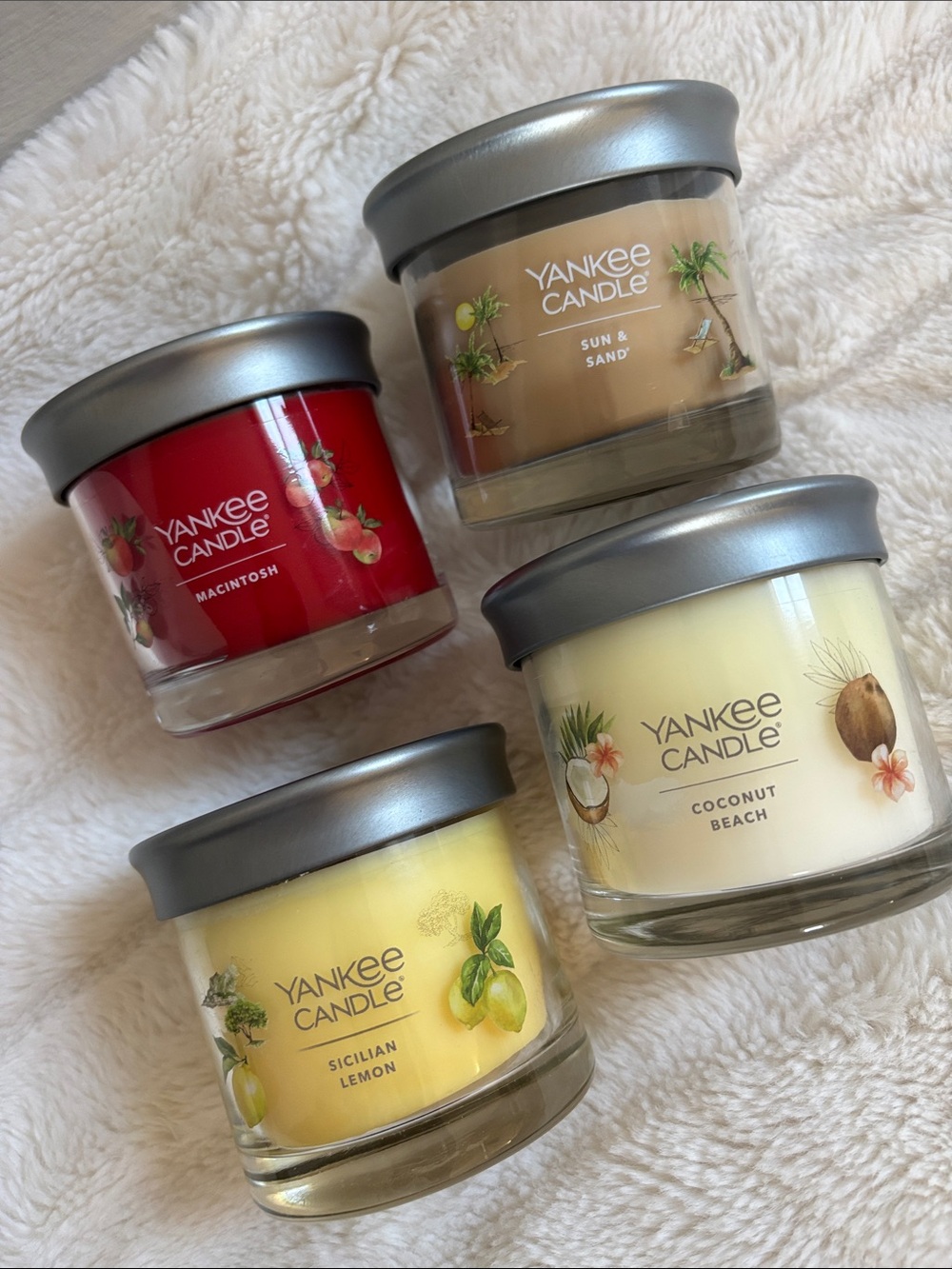 Four 4.3 oz Yankee Candles